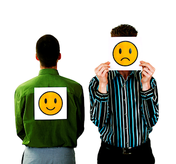 Holding up a happy face and a sad face
