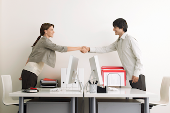 Two business professionals shaking hands